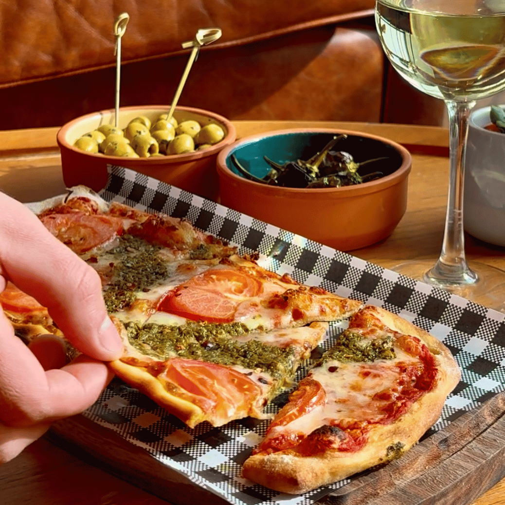 Hand-stretched pizza and wine